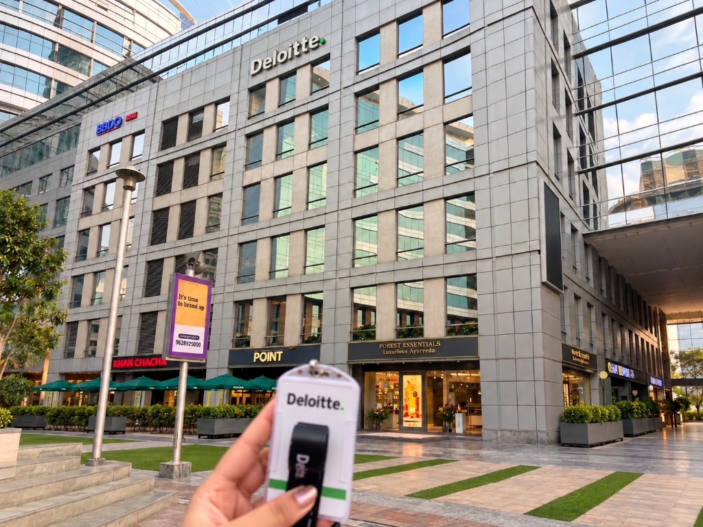 Deloitte building with employee badge