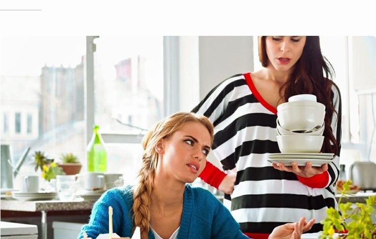 Roommates in kitchen experiencing stress